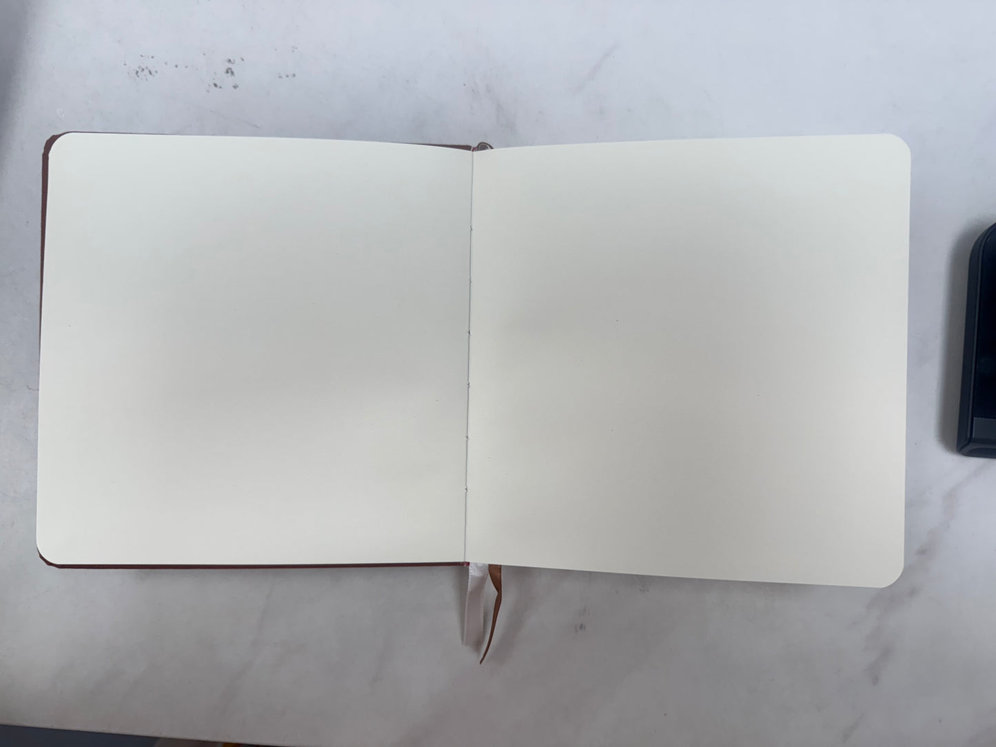 There's No Place Like Orange Foil Embossed Square Linen Notebook